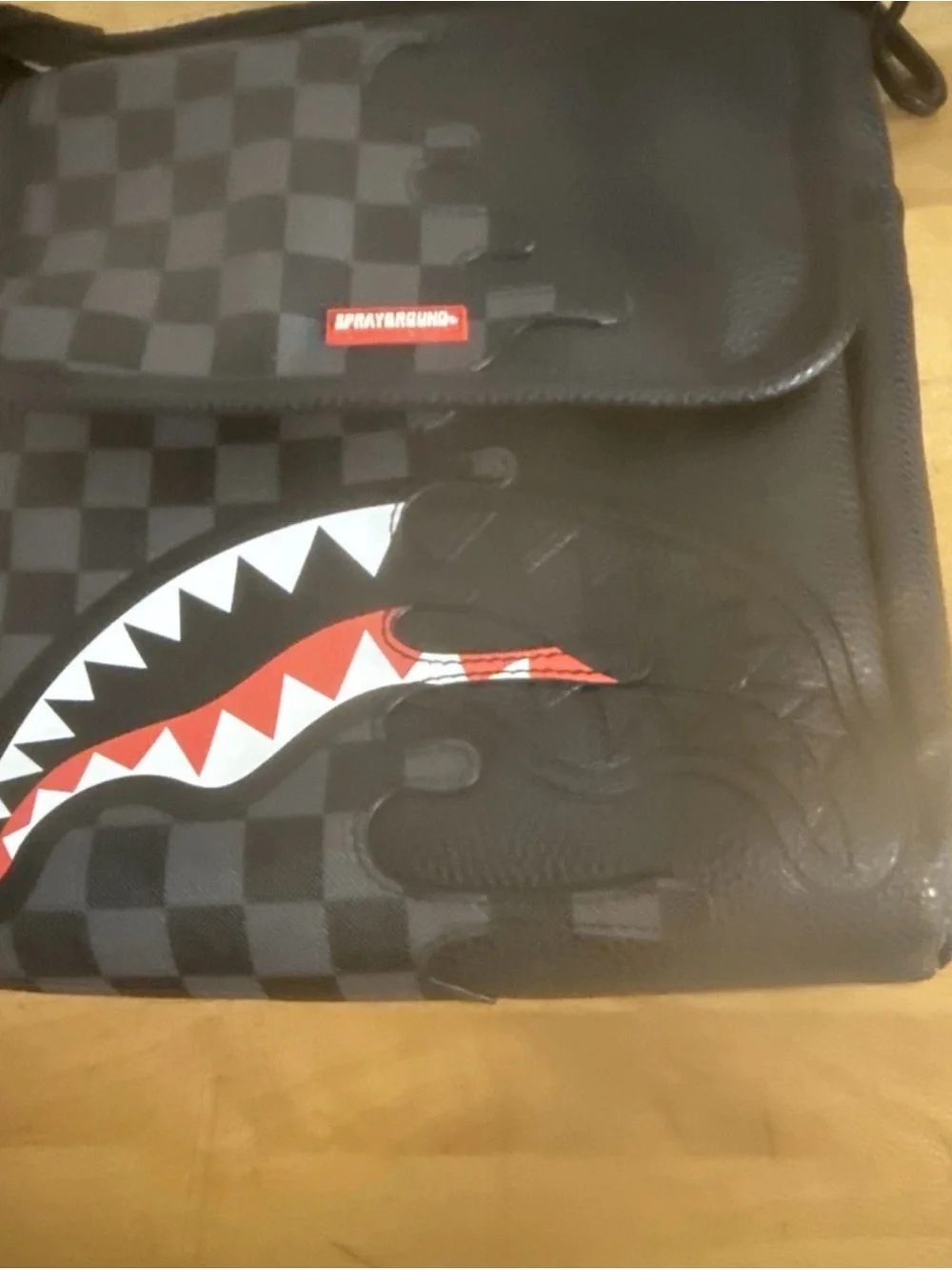 Sprayground Black Checker Shark Mouth Messenger Bag with Red & White Accent